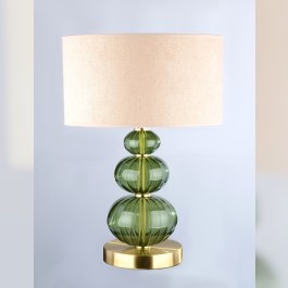 Eine diskrete Tischlampe aus dunkelgrünem Glas in der Farbe eines gefallenen Sterns (Moldavit).