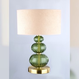 Eine diskrete Tischlampe aus dunkelgrünem Glas in der Farbe eines gefallenen Sterns (Moldavit).
